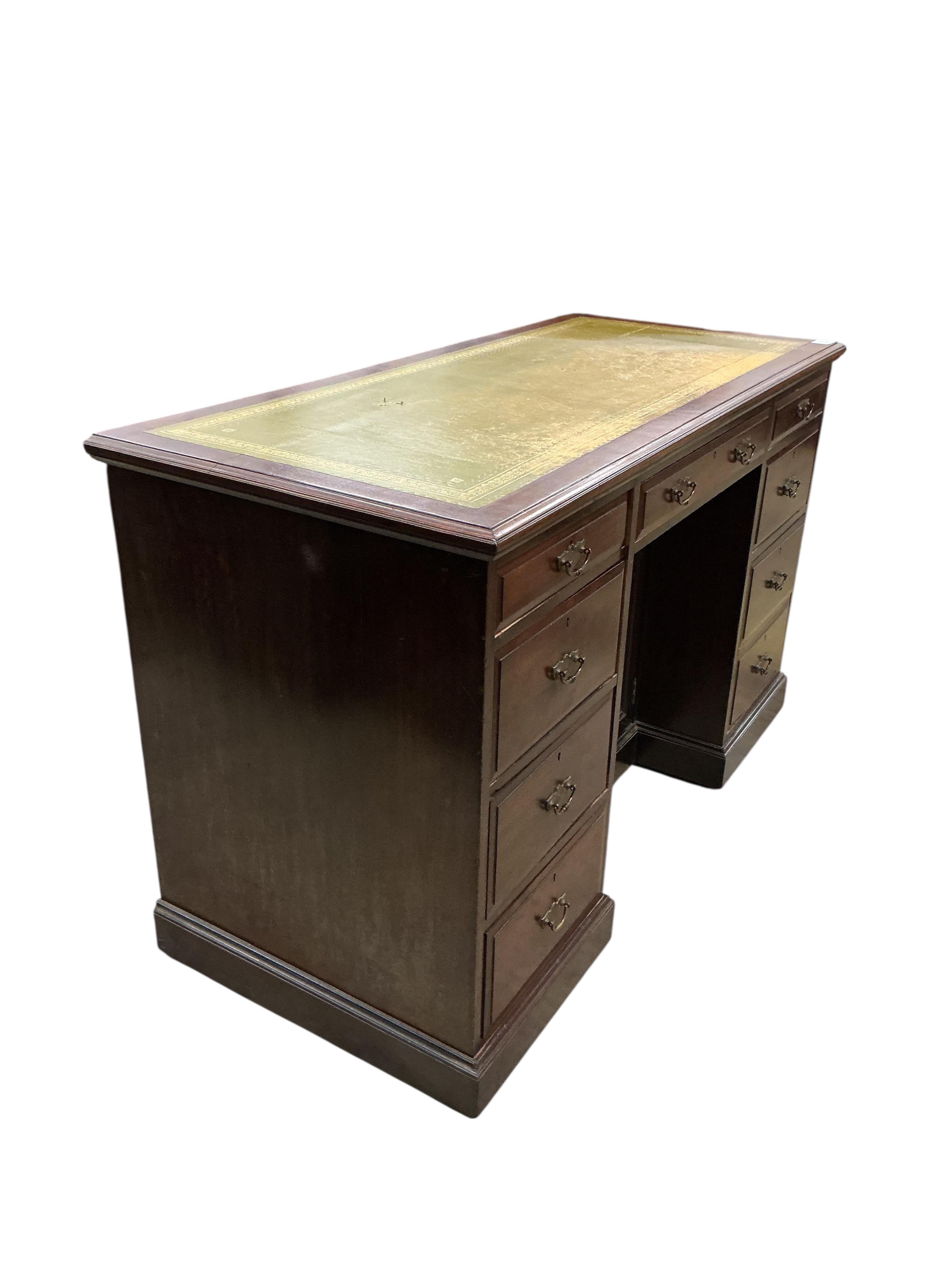 A late Victorian mahogany kneehole desk, width 125, depth 56cm, height 76cm